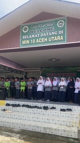 School children sing in uniforms on steps in Langnibong
