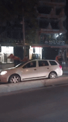 White car blocks sidewalk in Esenyurt, Turkey