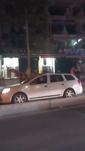 White car blocks sidewalk in Esenyurt, Turkey