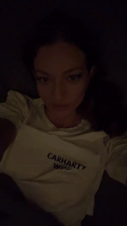 Woman says goodnight in Russian, kisses camera in Thailand