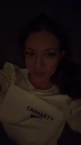 Woman says goodnight in Russian, kisses camera in Thailand