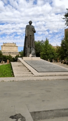 Bronze statue and autumn park scene in Yerevan