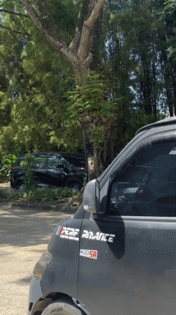 Men load supplies from pickup truck in Kuta Selatan