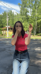 Woman dances while toddler eats flatbread in Izhevsk park