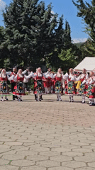 Traditional Bulgarian folk dancers perform in Markovo public space