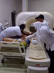 Hospital visit in Aceh: CT scan, palm-lined grounds, and koi