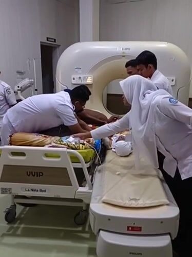 Hospital visit in Aceh: CT scan, palm-lined grounds, and koi