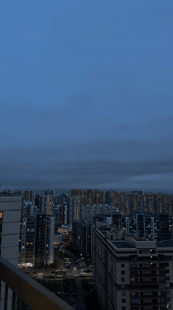 Dusk settles over Kudrovo residential towers
