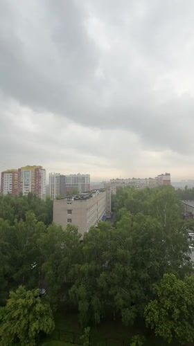 Overcast morning views of Izhevsk's tree-lined cityscape