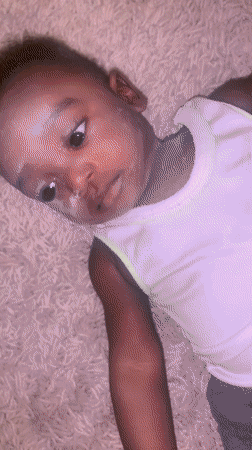 Baby photographed on carpet in Barakin Akawo, Nigeria