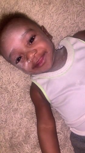 Baby photographed on carpet in Barakin Akawo, Nigeria
