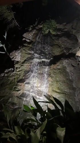 Dinner and a waterfall feature on a summer night in Boreti