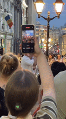 Street musicians draw crowds in European-style city district
