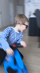 Toddler plays with ride-on toy at Chaikovsky home
