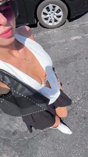 Woman photographed in car in Palm Springs evening
