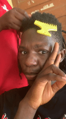Hair braiding session captured on video in Jos, Nigeria