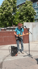 Cowboy hat musician performs near Moscow monastery complex