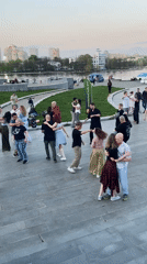 Public dancing and leisure activities captured in Yekaterinburg riverfront plaza