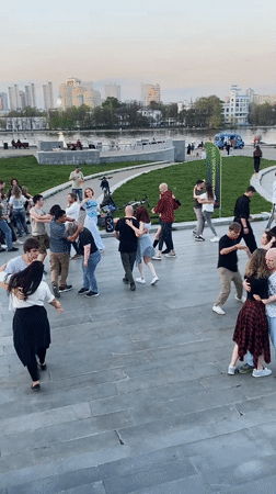 Public dancing and leisure activities captured in Yekaterinburg riverfront plaza