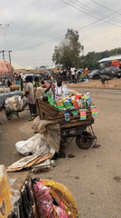 Everyday street commerce and traffic in Bukuru, Nigeria