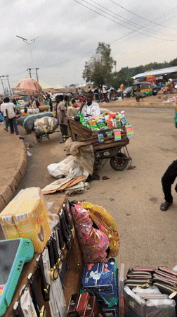 Everyday street commerce and traffic in Bukuru, Nigeria