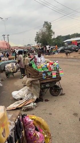 Everyday street commerce and traffic in Bukuru, Nigeria
