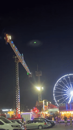 Neon-lit pendulum ride glows at a Varna amusement park