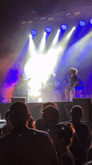 Three-piece live set under blue and white stage lights, Sant Just Desvern