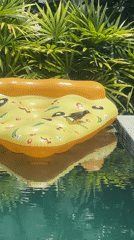 Bird perches on pizza float in Thai tropical setting