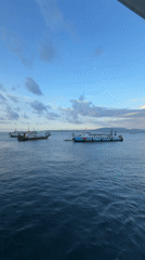 Morning ferry crossing at Ketapang port under dramatic skies