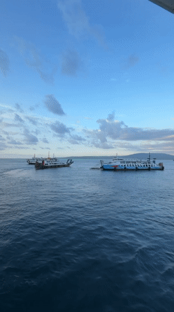Morning ferry crossing at Ketapang port under dramatic skies