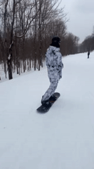 Snowboarder hits slopes at Jay Peak resort during cloudy evening