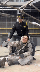 Actors film police-military scene at Qingdao studio