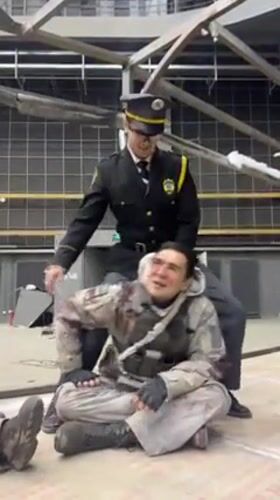 Actors film police-military scene at Qingdao studio