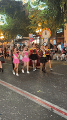 Costumed parade fills Alicante streets during evening festival celebration