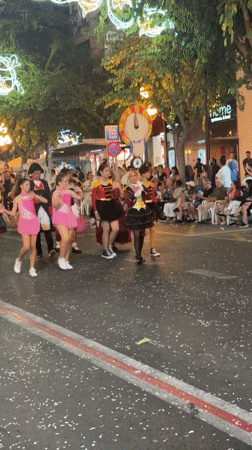 Costumed parade fills Alicante streets during evening festival celebration