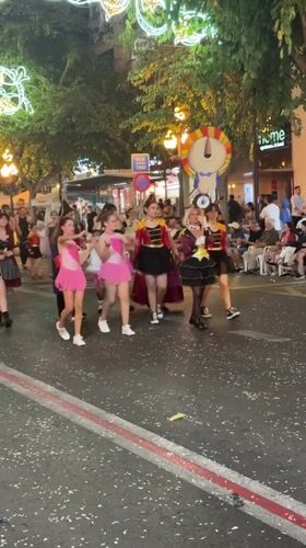 Costumed parade fills Alicante streets during evening festival celebration