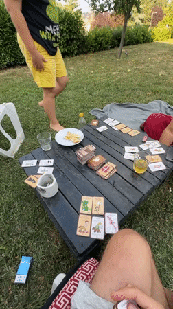 Outdoor card game and contrail skies over Belgrade