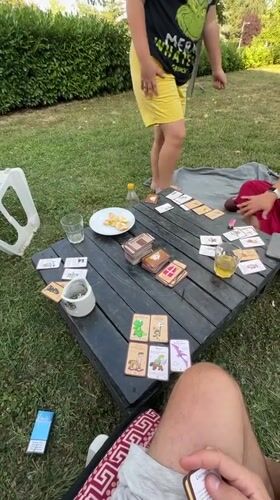 Outdoor card game and contrail skies over Belgrade