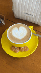 Heart latte art and cookies documented in Kuta Selatan