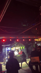 DJ set and nightlife vibes at an outdoor venue in Howayi