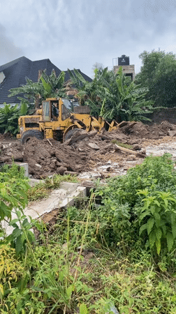 Construction crews operate heavy machinery in Badagry Nigeria