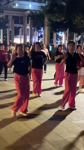 Outdoor dancing and a resting dog in Jiyang District