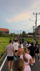 Group jog observed on narrow road in Cemagi, Indonesia