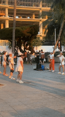 Evening exercise groups gather on Nha Trang beachfront promenade