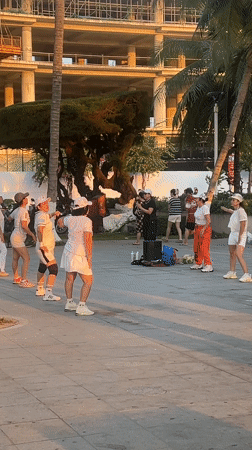 Evening exercise groups gather on Nha Trang beachfront promenade