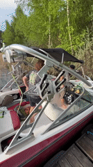 Casual afternoon boating activities captured at Russian lakeside dock