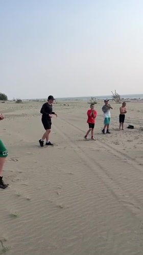 Beach stretching session on the sandy shores of Krasnoturansk