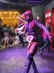 Traditional folk dance performance on a lit stage in Kuşadası