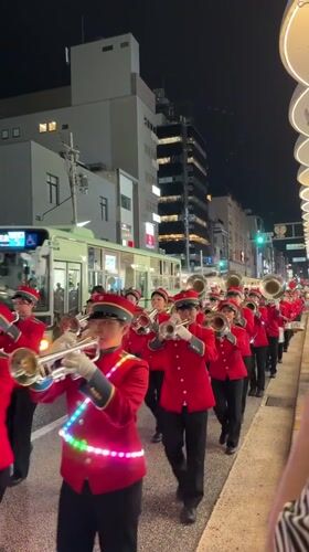 Night parade with marching band, cheerleaders observed in Kyoto